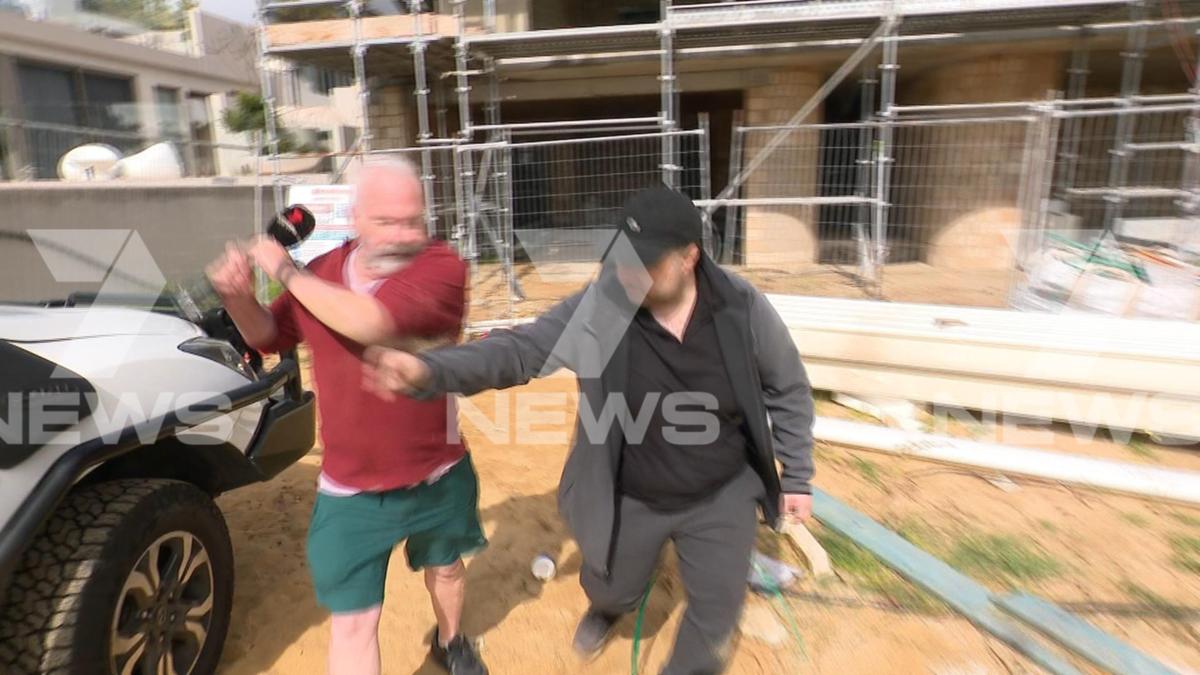 A scuffle then erupts between Parry and Mr Michel-Elhaj before the pair fall through a fence and to the ground. 