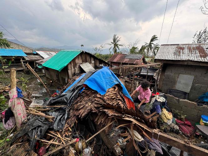 A person inspects a destroyed house in Santa Ana town, Cagayan province, north of Manila, after Typhoon Yinxing, November 8, 2024.