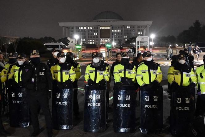 Police officers deployed in front of parliament in Seoul on December 3, 2024.