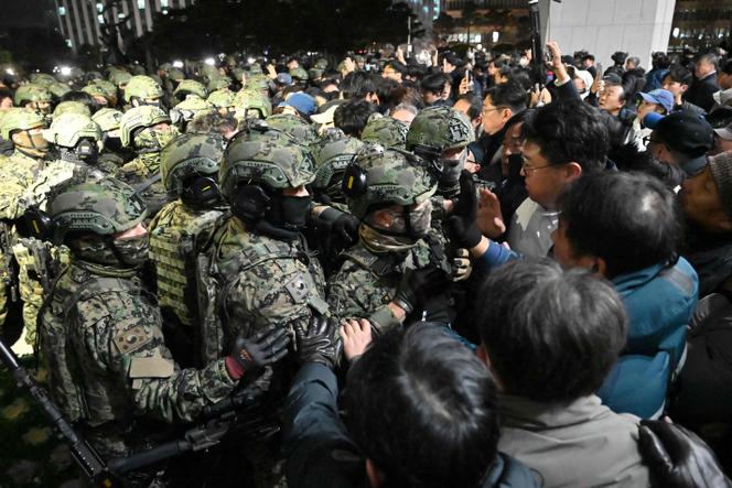 Soldiers try to enter the National Assembly in Seoul, Wednesday, December 4, 2024.