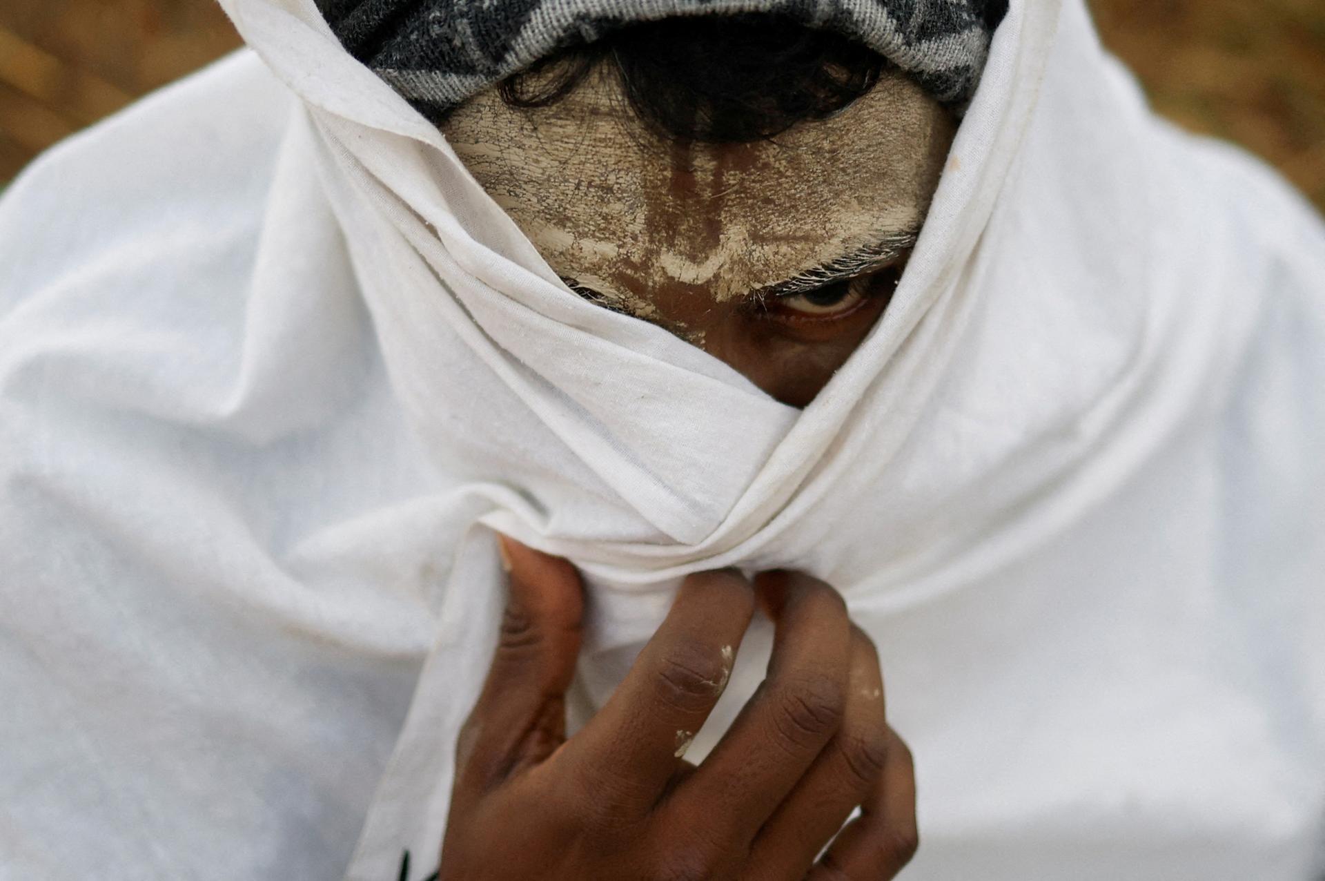 A faithful, his forehead covered with ash, after his swim in the Ganges, on January 13, 2025.