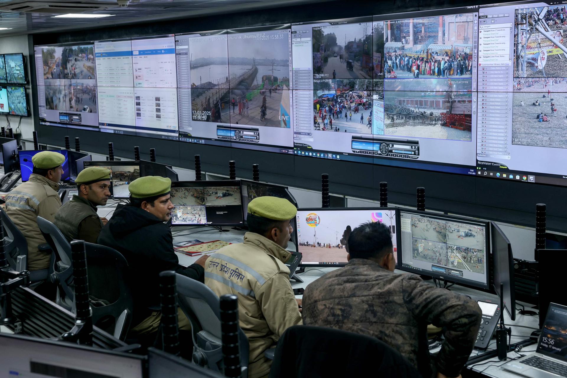 The police monitor the situation on the screens of the integrated command and control center, set up to manage and control the crowd, during the Maha Kumbh Mela festival in Prayagraj, on January 17, 2025.